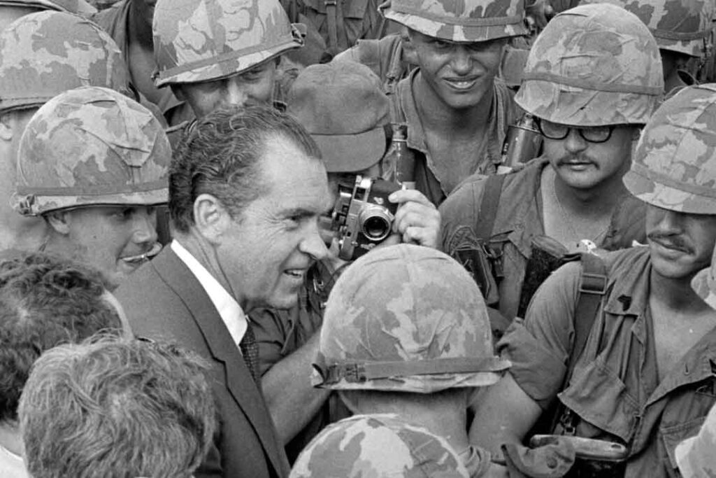 President Richard M. Nixon meets with soldiers of the 1st Infantry Division at their base camp at Di An during his only presidential visit to South Vietnam.