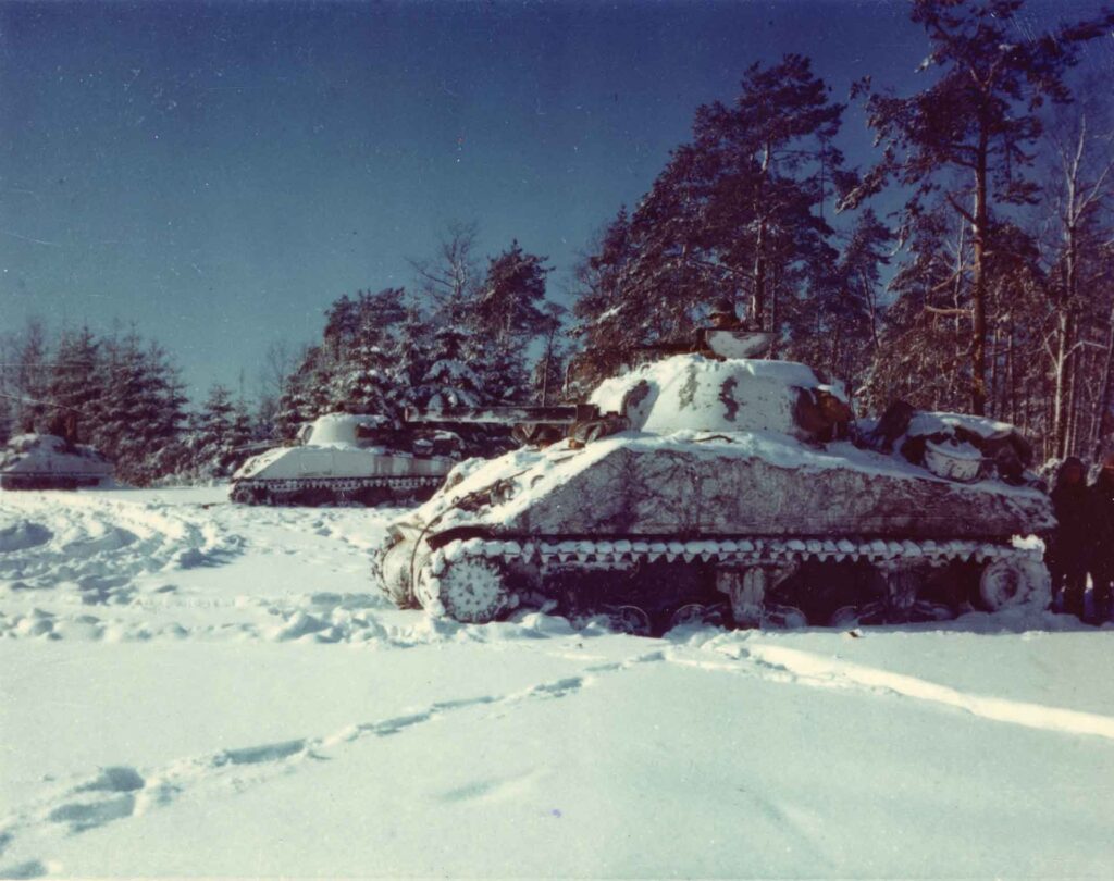 M4 Shermans of the 10th Tank Battalion in Clarke’s, CCB, 7th Armored Division, look for enemy armor near St. Vith, Belgium, 23 January 1945. Just over a month after withdrawing from the town, Clarke’s command recaptured St. Vith. (National Archives)