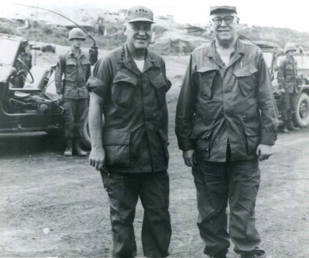 General Bruce Clarke (Ret.), stands with his former subordinate General Creighton Abrams, Deputy Commander, Military Assistance Command, Vietnam, in Vietnam during the Tet Offensive in 1968. (National Archives)