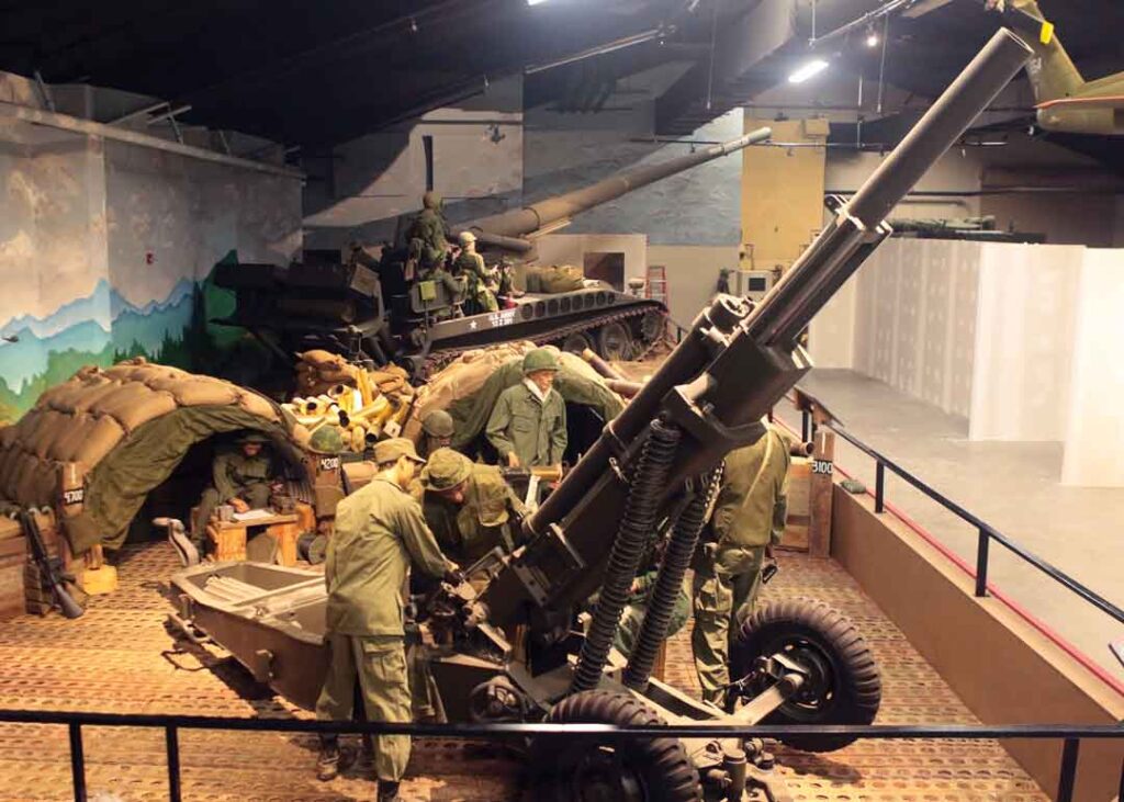 An M102 and simulated fire support base are highlights of an exhibit on Vietnam War field artillery at the U.S. Army Artillery Museum at Fort Sill, Oklahoma. (U.S. Army Artillery Museum)