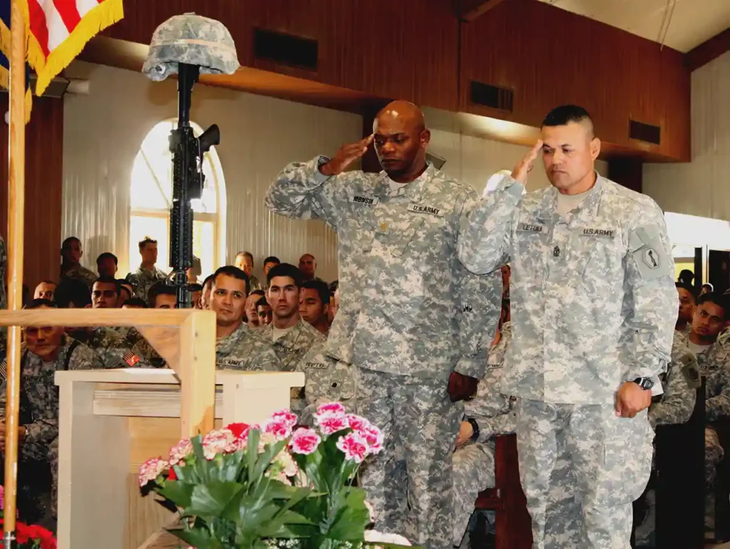 Major Ralph Robinson & 1st Sergeant Uluao Letuli render a final salute to Specialist Casey L. Hills in a memorial service at Camp Virginia, Kuwait, 28 June 2009. Casey died of his injuries following a multivehicle collision while conducting security in Iraq on 24 June. (U.S. Army)