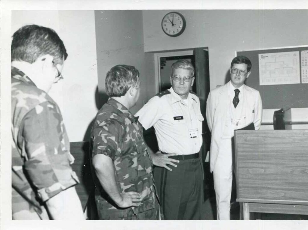 Major General Wayne Jackson, commanding general of the 97th Army Reserve Command, visits with members of the 5th PSYOP Group during GLOBEX ’83 as Colonel Bell (in civilian clothes) looks on. 