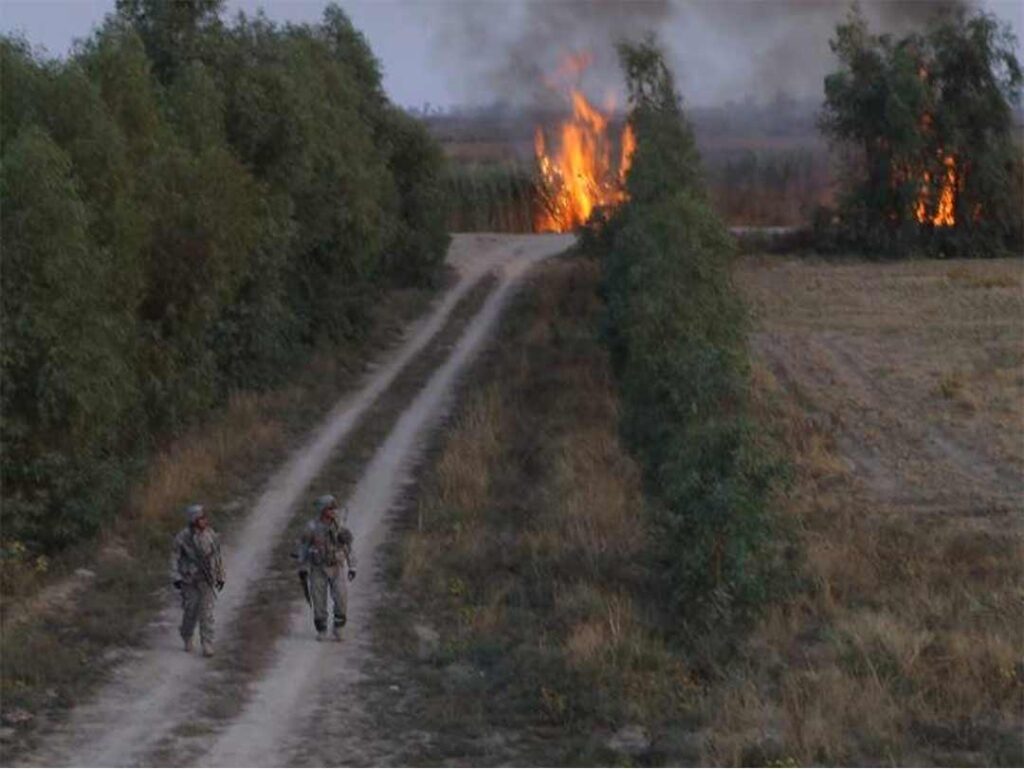 Soldiers from Alpha Troop set fire to grass along canals to flush insurgents from their positions, 15 November 2006. (Michael Clemens)