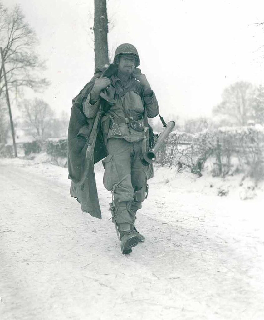 After three hours of guard duty at an outpost, Private First Class Vernon Haught, a glider infantryman with the 325th GIR, looks forward to finding a warm place to get some rest, 6 January 1945. Haught’s quote, “I’m the 82d Airborne and this is as far as the bastards are going!” during the Battle of the Bulge lives on in the lore of the 82d Airborne Division. (National Archives) 