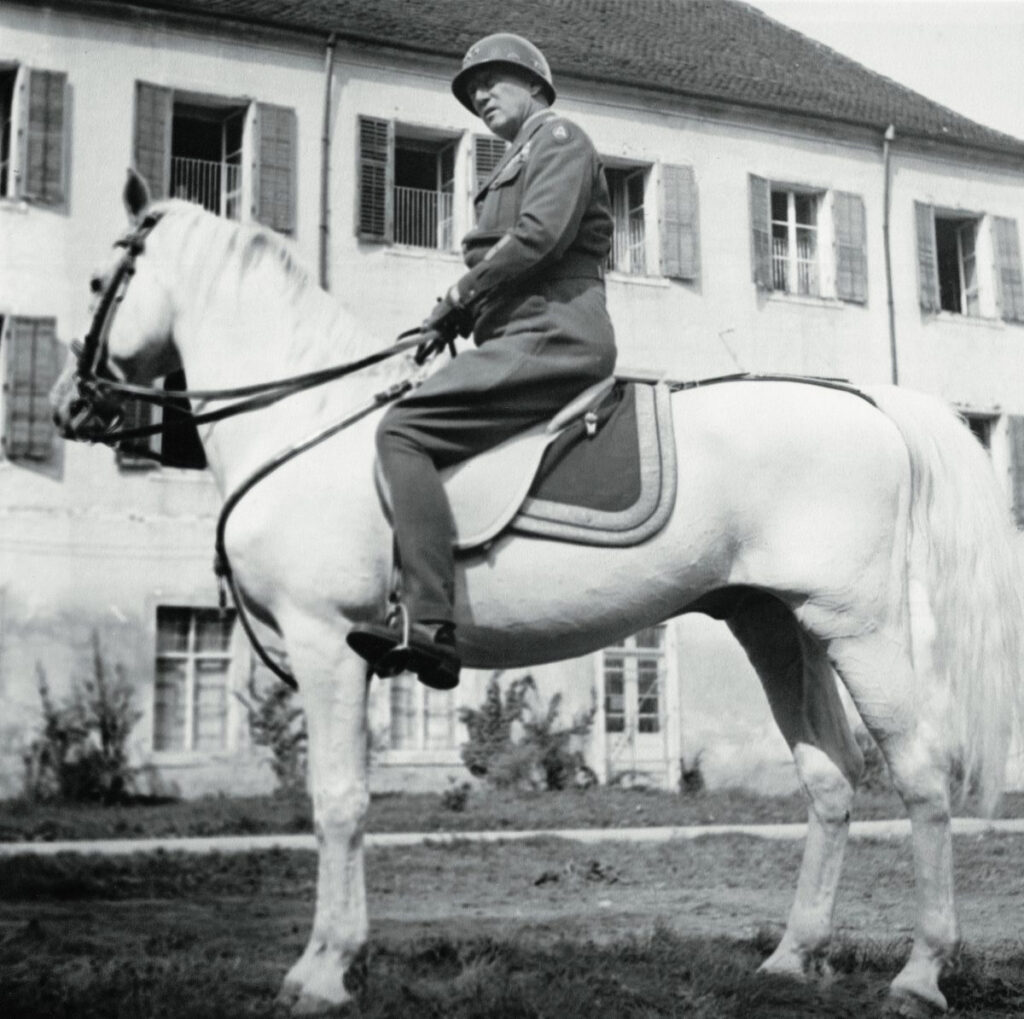 Patton atop a Lippizaner stallion in Austria sometime in 1945. (National Archives)